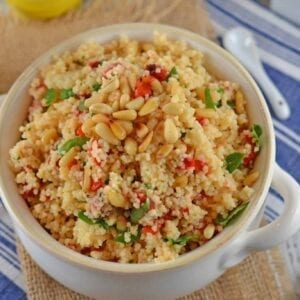 Italian Couscous is an easy side dish recipe perfect for serving with any meal. Sun dried tomatoes, garlic and pinenuts spruce up the dish!