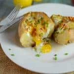 Stuffed Breakfast Potato on a white plate cut in half