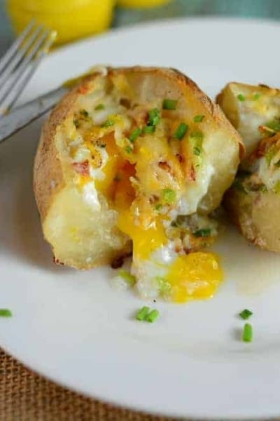 Stuffed Breakfast Potato on a white plate cut in half