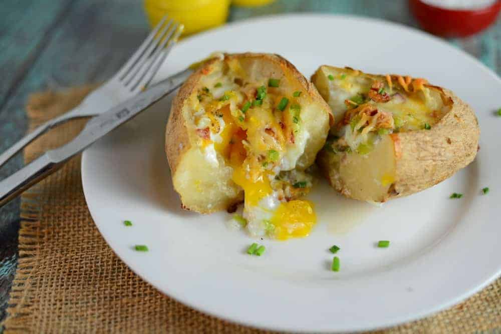 Stuffed Breakfast Potatoes Recipe- baked potatoes stuffed with bacon, cheese, veggies or anything you want! Great breakfast ideas for serving a crowd. Super easy and super tasty! www.savoryexperiments.com 