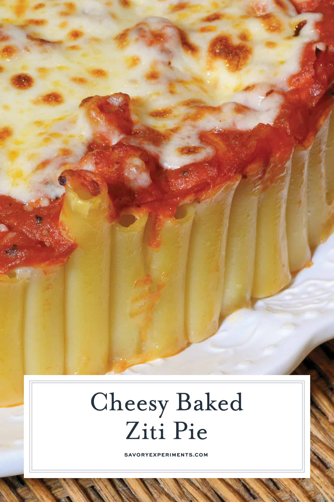Baked Ziti Pie is a new twist on an old classic. Ziti smothered in marinara and cheese, but in pie form! Make with a side of Italian sausage or meatballs. #bakedzitirecipes #howtomakebakedziti www.savoryexperiments.com