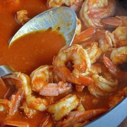 Beer Buttered Shrimp is a tomato based sauce infused with your choice of beer, spices and simmered with shrimp. Serve as an appetizer or over rice as an entree. #butteredshrimprecipe #easyshrimprecipe www.savoryexperiments.com
