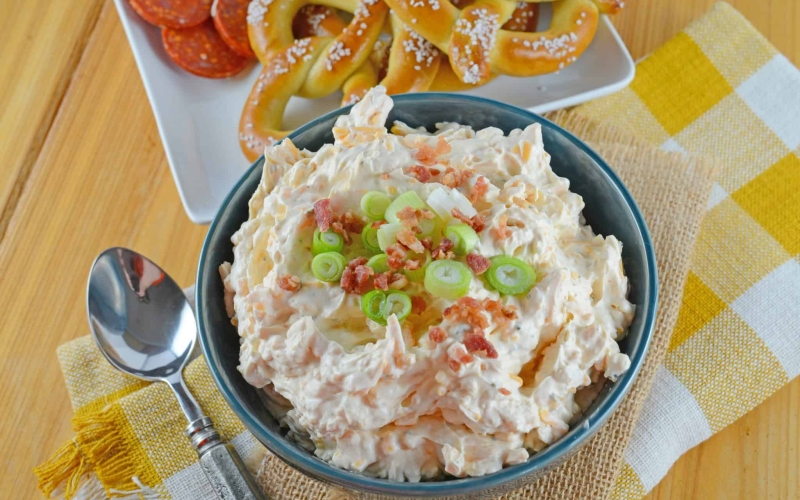 Beer Cheese Dip is an easy, spreadable, zesty pub cheese great for serving with soft pretzels, crackers, carrots, celery sticks or chips! #beercheesedip #beercheesepretzeldip www.savoryexperiments.com