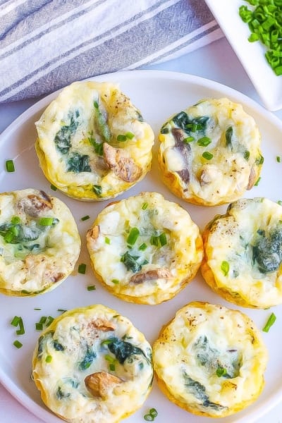 overhead of egg muffins on a white plate