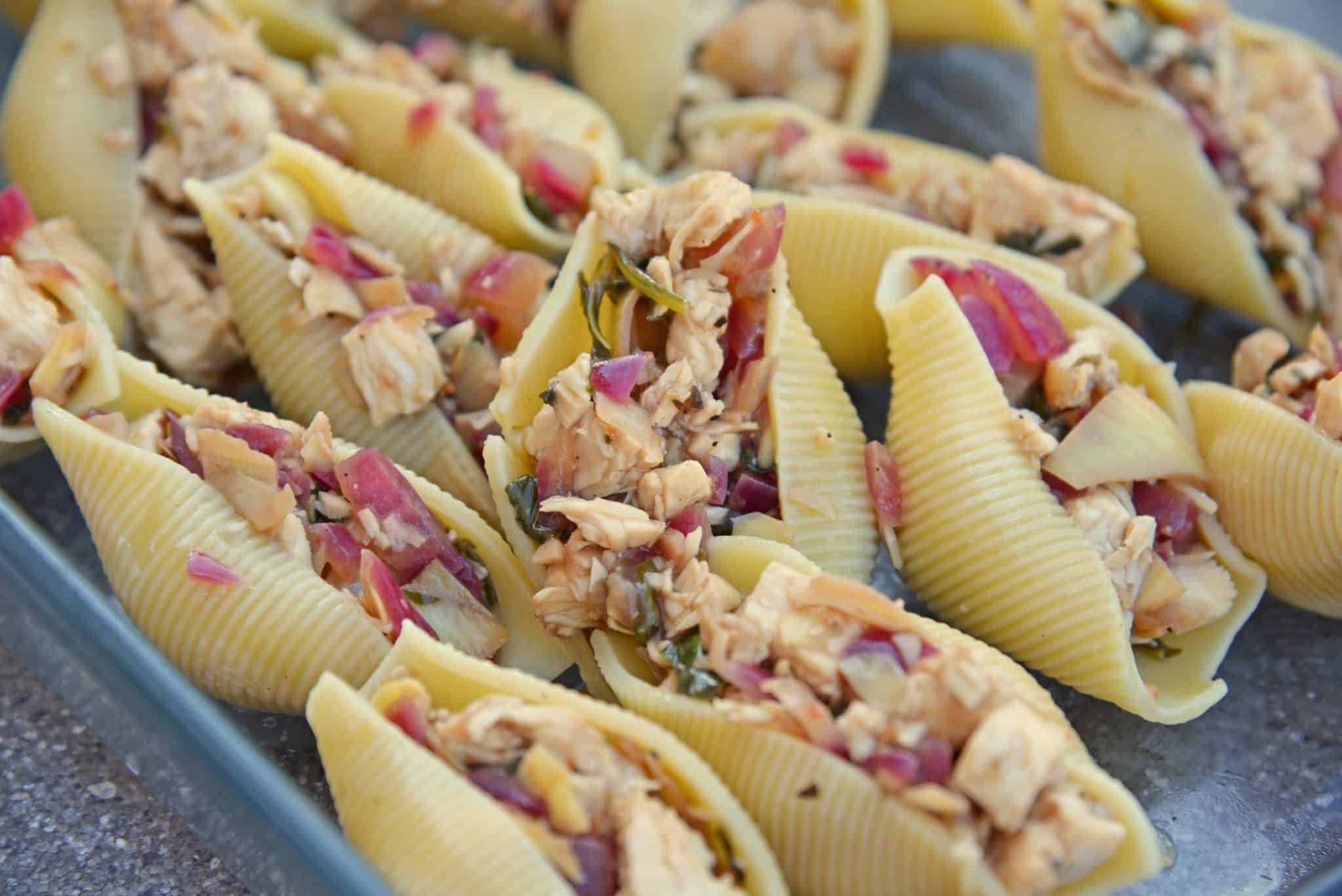 Prosciutto Wrapped Chicken Stuffed Shells and Creamy Brie Sauce is a rich and savory easy dinner you'll want to make again and again! #chickenstuffedshells #stuffedshellsrecipe www.savoryexperiments.com