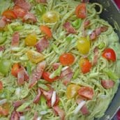 Healthy Creamy Avocado Pasta Sauce is a great alternative to traditional Alfredo sauce. Avocados, thick Greek yogurt, lemon juice, tomatoes and scallions make this wildly popular dish a favorite. Bacon optional! #avocadocreamsauce #creamyavocadopastasauce www.savoryexperiments.com
