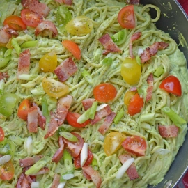 Healthy Creamy Avocado Pasta Sauce is a great alternative to traditional Alfredo sauce. Avocados, thick Greek yogurt, lemon juice, tomatoes and scallions make this wildly popular dish a favorite. Bacon optional! #avocadocreamsauce #creamyavocadopastasauce www.savoryexperiments.com
