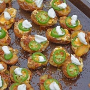 jalapeno popper potato skins on a baking sheet