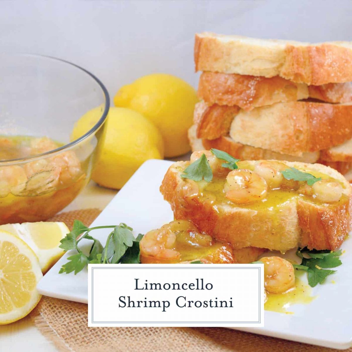 Limoncello Shrimp Crostini is made up of agrodolce sauce with shrimp, caramelized garlic and parsley spooned over crusty French bread! Ready in 20 minutes! #crostinirecipes #limoncello www.savoryexperiments.com