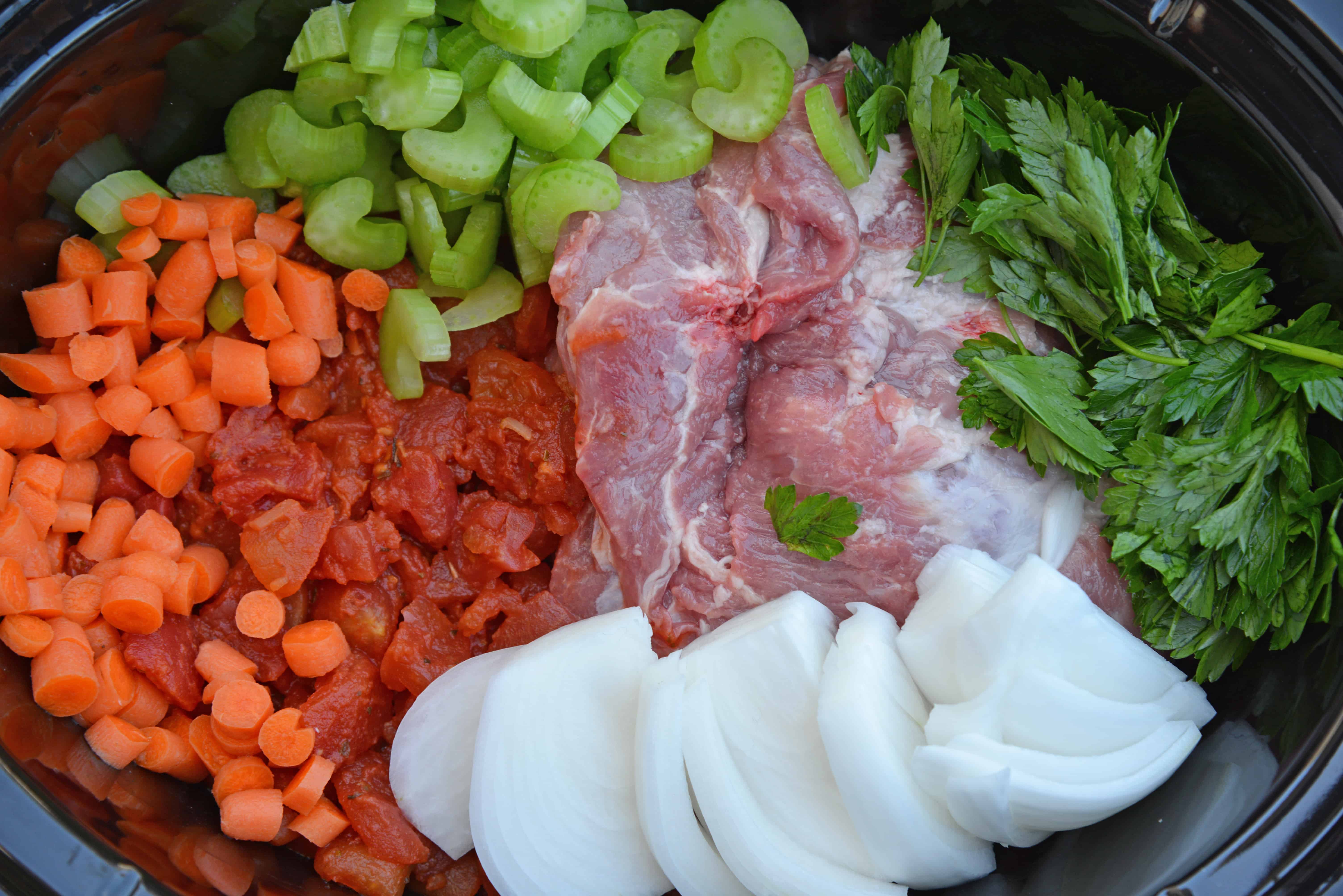 Slow Cooker Ragu uses a blend of 7 vegetables with shredded pork and flavorful spices to make a hearty and delicious ragu sauce. Serve over pasta. Also freezer friendly! #slowcookerragu #slowcookerrecipes www.savoryexperiments.com