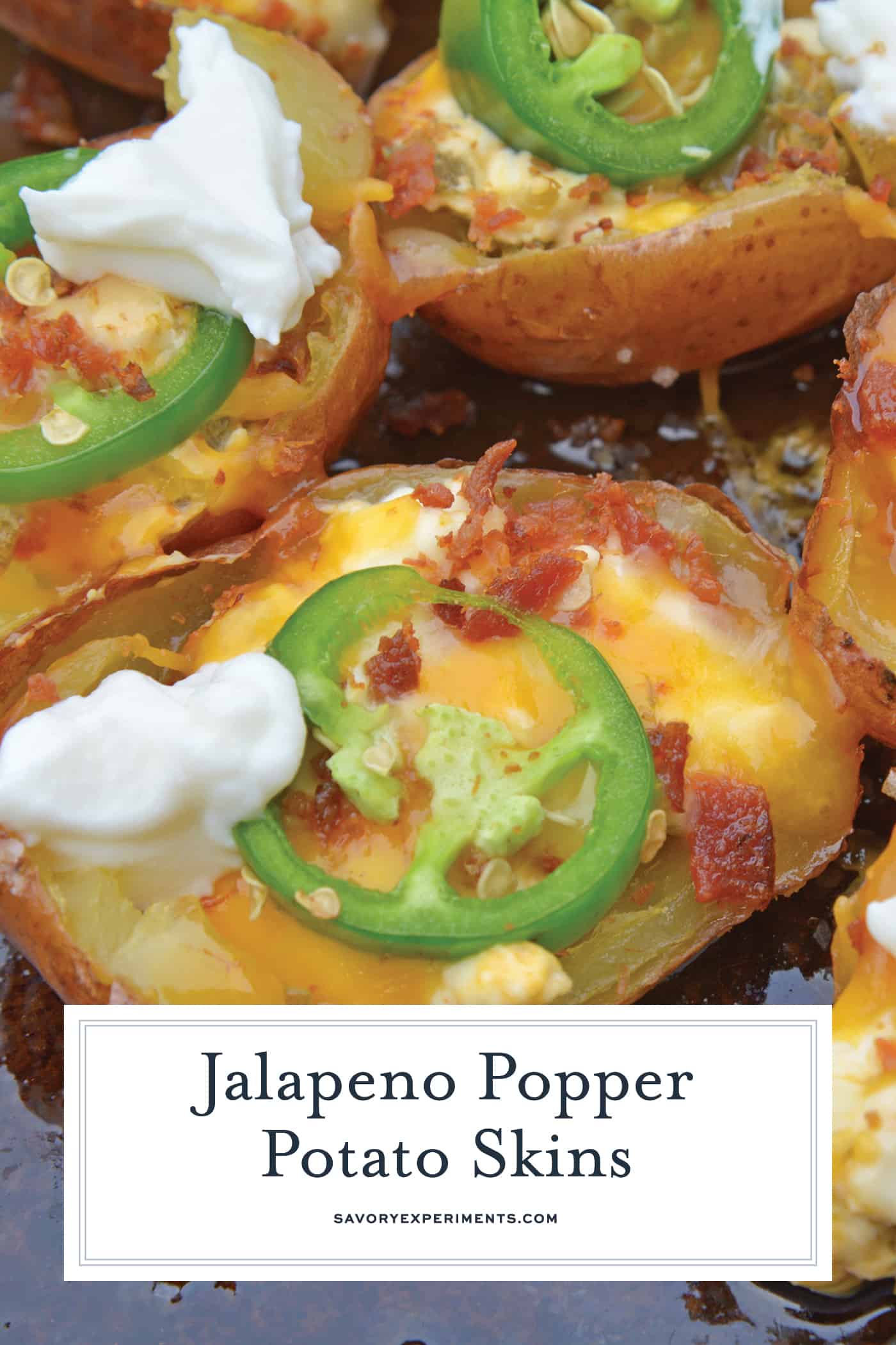 Jalapeno Popper Potato Skins are bite-sized potatoes filled with 3 types of cheese, fresh jalapenos, bacon and cooled off with sour cream. Perfect for a snack or party appetizer! #potatoskins #jalapenopoppers www.savoryexperiments.com