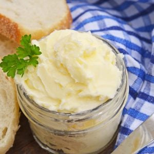 This Homemade Butter Recipe is ready in just 5 minutes using your blender, heavy cream, ice water and salt. You'll wonder why you never made butter at home before! #homemadebutter www.savoryexperiments.com