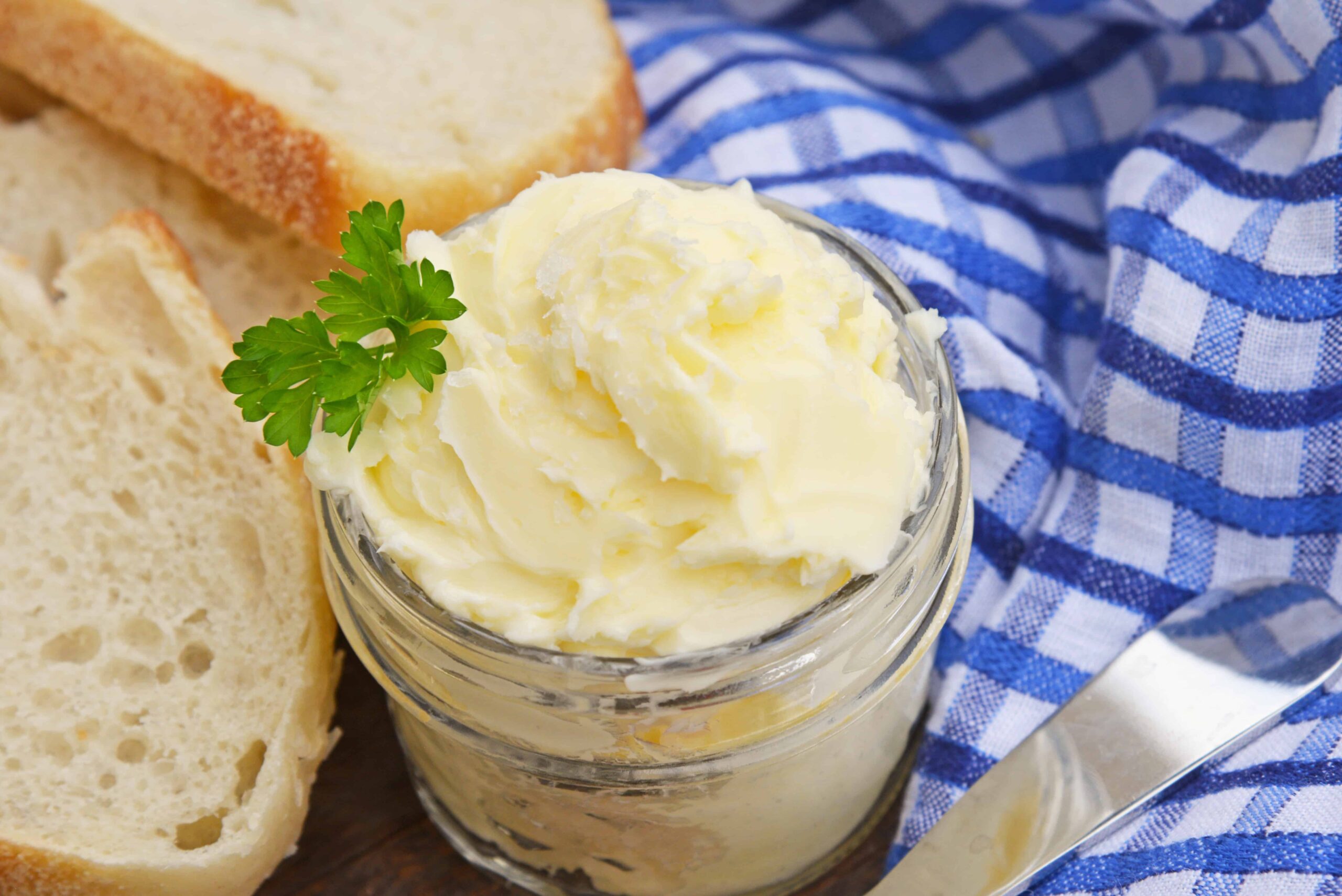 This Homemade Butter Recipe is ready in just 5 minutes using your blender, heavy cream, ice water and salt. You'll wonder why you never made butter at home before! #homemadebutter www.savoryexperiments.com