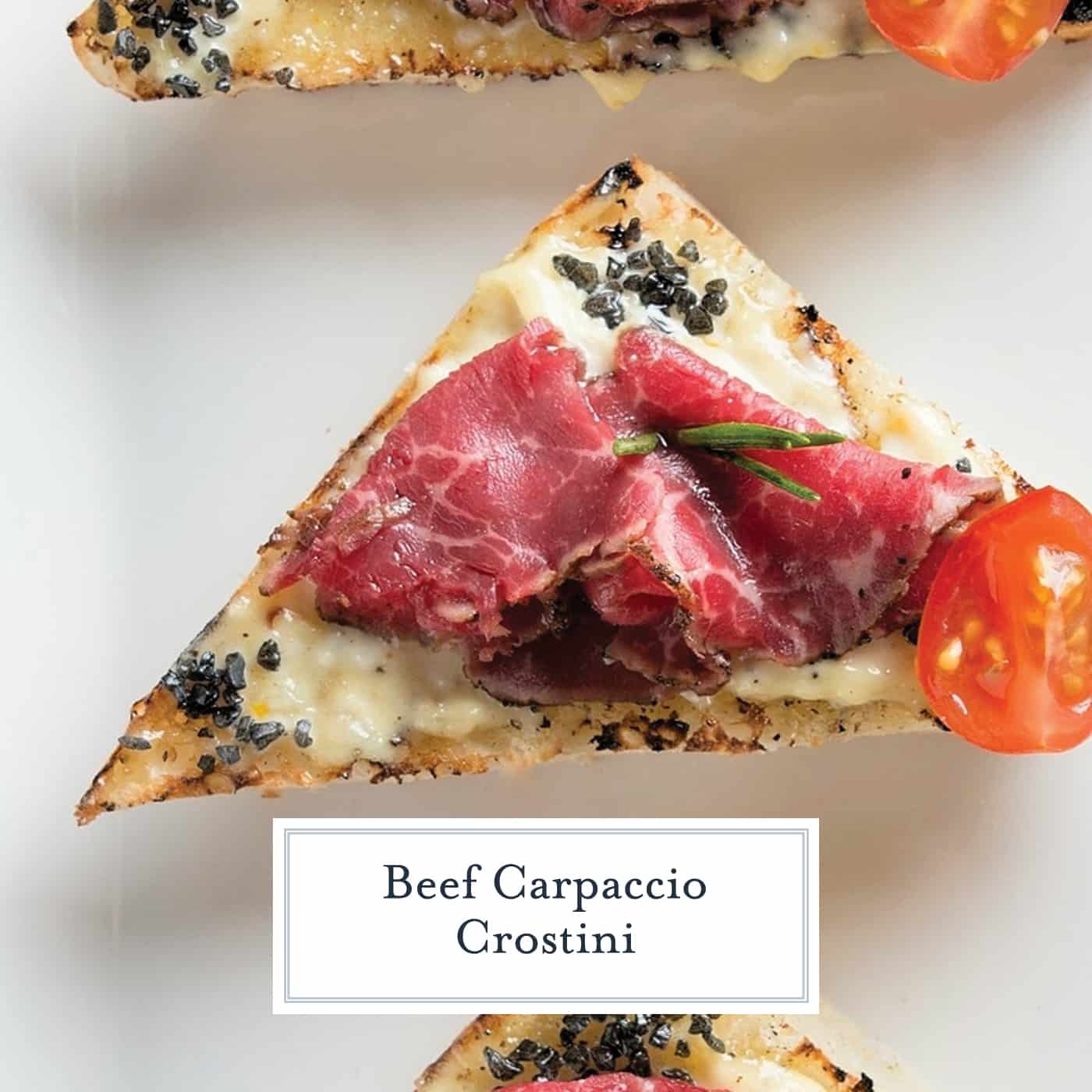 Beef Carpaccio Crostini are thinly sliced pieces of beef with garlic aioli, black sea salt and fresh rosemary with tomato. The perfect party appetizer. #beefcarpaccio #crostinirecipes www.savoryexperiments.com 