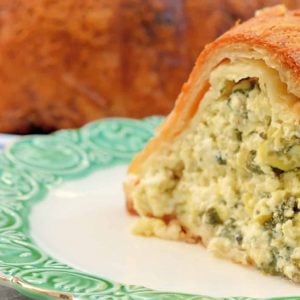 This Cheese Torte combines 3 types of cheese with spinach, artichoke and seasoning in crispy layers of buttery Phyllo dough. The ultimate appetizer, side dish or brunch dish! #cheesetorte #spinachandartichoke www.savoryexperiments.com