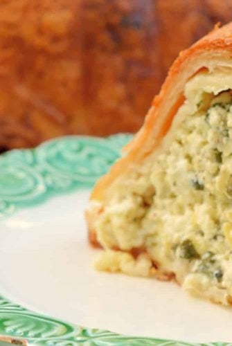 This Cheese Torte combines 3 types of cheese with spinach, artichoke and seasoning in crispy layers of buttery Phyllo dough. The ultimate appetizer, side dish or brunch dish! #cheesetorte #spinachandartichoke www.savoryexperiments.com
