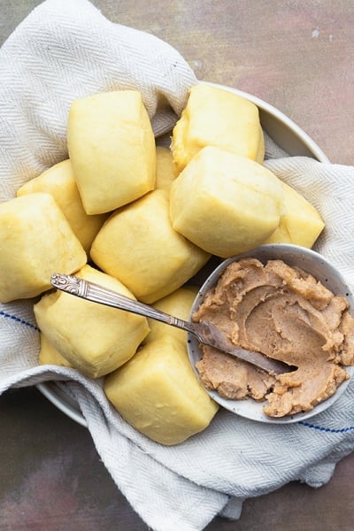 basket of yeast rolls with honey cinnamon butter