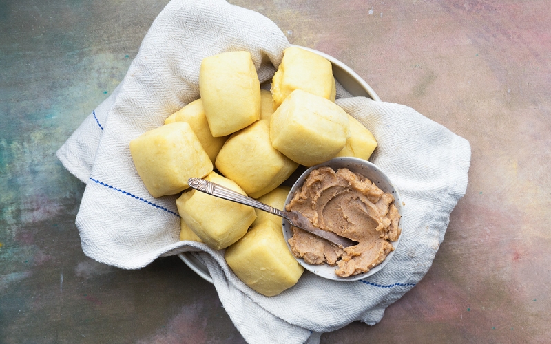 basket of yeast rolls with honey cinnamon butter