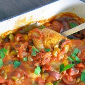 Creole Chicken is a baked chicken recipe using a spicy tomato-based sauce with vegetables and spices. Serve over rice. #spicybakedchicken www.savoryexperiments.com