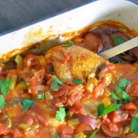 Creole Chicken is a baked chicken recipe using a spicy tomato-based sauce with vegetables and spices. Serve over rice. #spicybakedchicken www.savoryexperiments.com