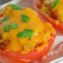 Spaghetti Squash Stuffed Tomatoes are juicy hallowed out tomatoes filled with spaghetti squash and topped with gooey cheddar cheese. The perfect low carb side dish! #lowcarbsidedish #tomatorecipes #spaghettisquashrecipes www.savoryexperiments.com