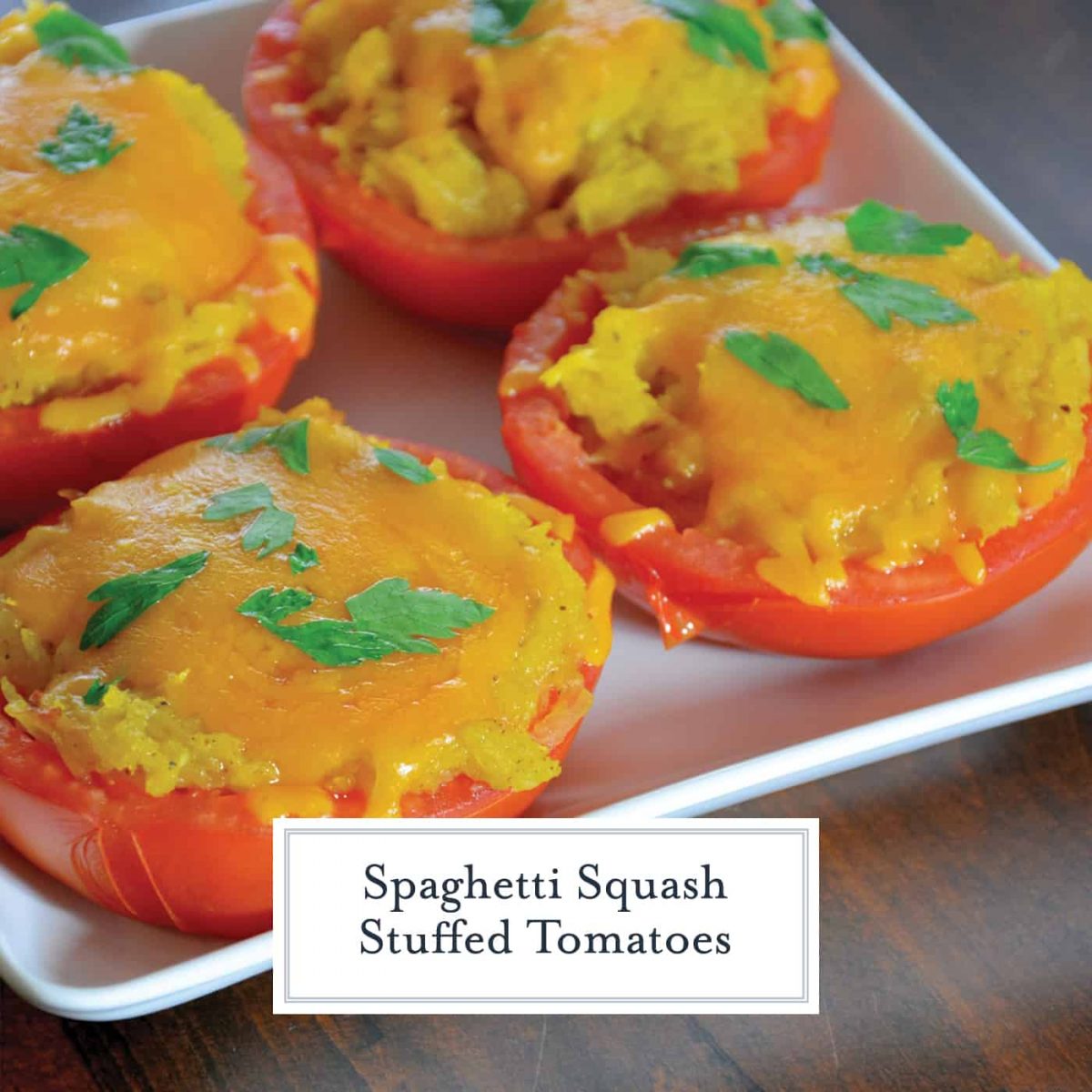 Spaghetti Squash Stuffed Tomatoes are juicy hallowed out tomatoes filled with spaghetti squash and topped with gooey cheddar cheese. The perfect low carb side dish! #lowcarbsidedish #tomatorecipes #spaghettisquashrecipes www.savoryexperiments.com