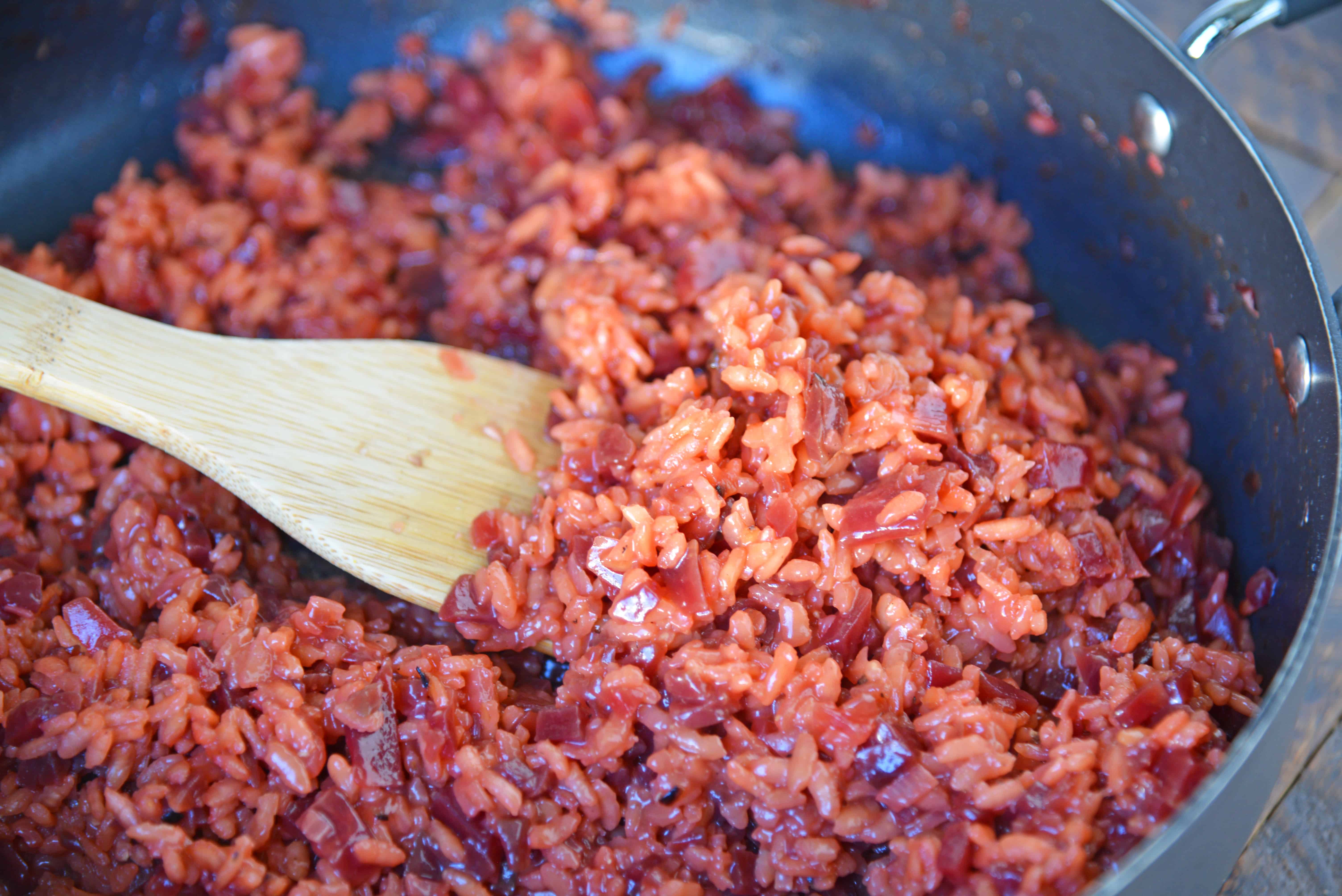 Beet Risotto is an easy risotto recipe that uses beets, shallots and garlic for a vibrant dish. Top with cool ricotta and honey. #beetrisotto #howtomakerisotto www.savoryexperiments.com 