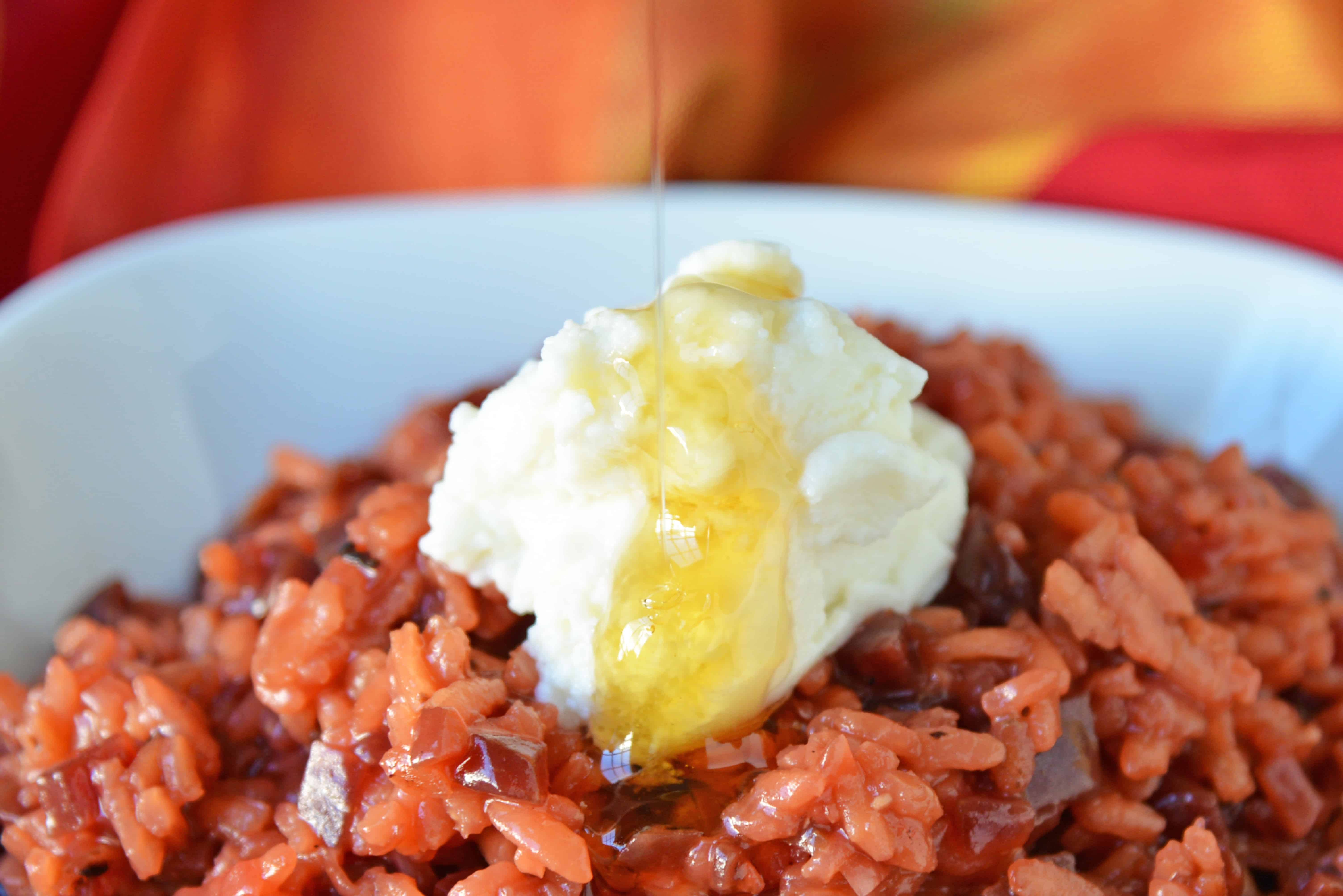 Beet Risotto is an easy risotto recipe that uses beets, shallots and garlic for a vibrant dish. Top with cool ricotta and honey. #beetrisotto #howtomakerisotto www.savoryexperiments.com