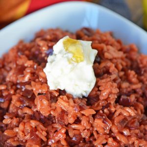Beet Risotto is an easy risotto recipe that uses beets, shallots and garlic for a vibrant dish. Top with cool ricotta and honey. #beetrisotto #howtomakerisotto www.savoryexperiments.com