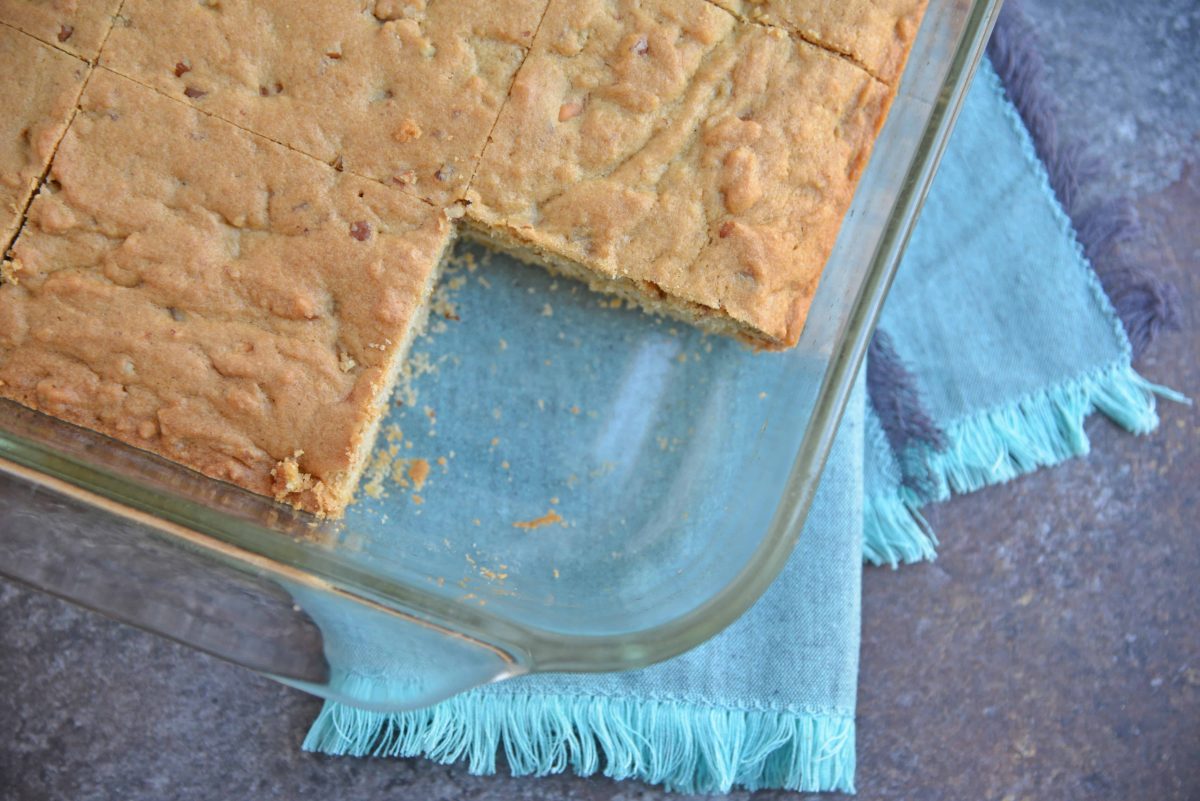 Soft Butterscotch Blondies are soft brown butter brownies loaded with butterscotch chips and drizzled with salted caramel sauce. #brownbutterbrownies #butterscotchbrownies www.savoryexperiments.com 