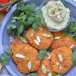 sweet potato pancakes with scallions on a blue plate