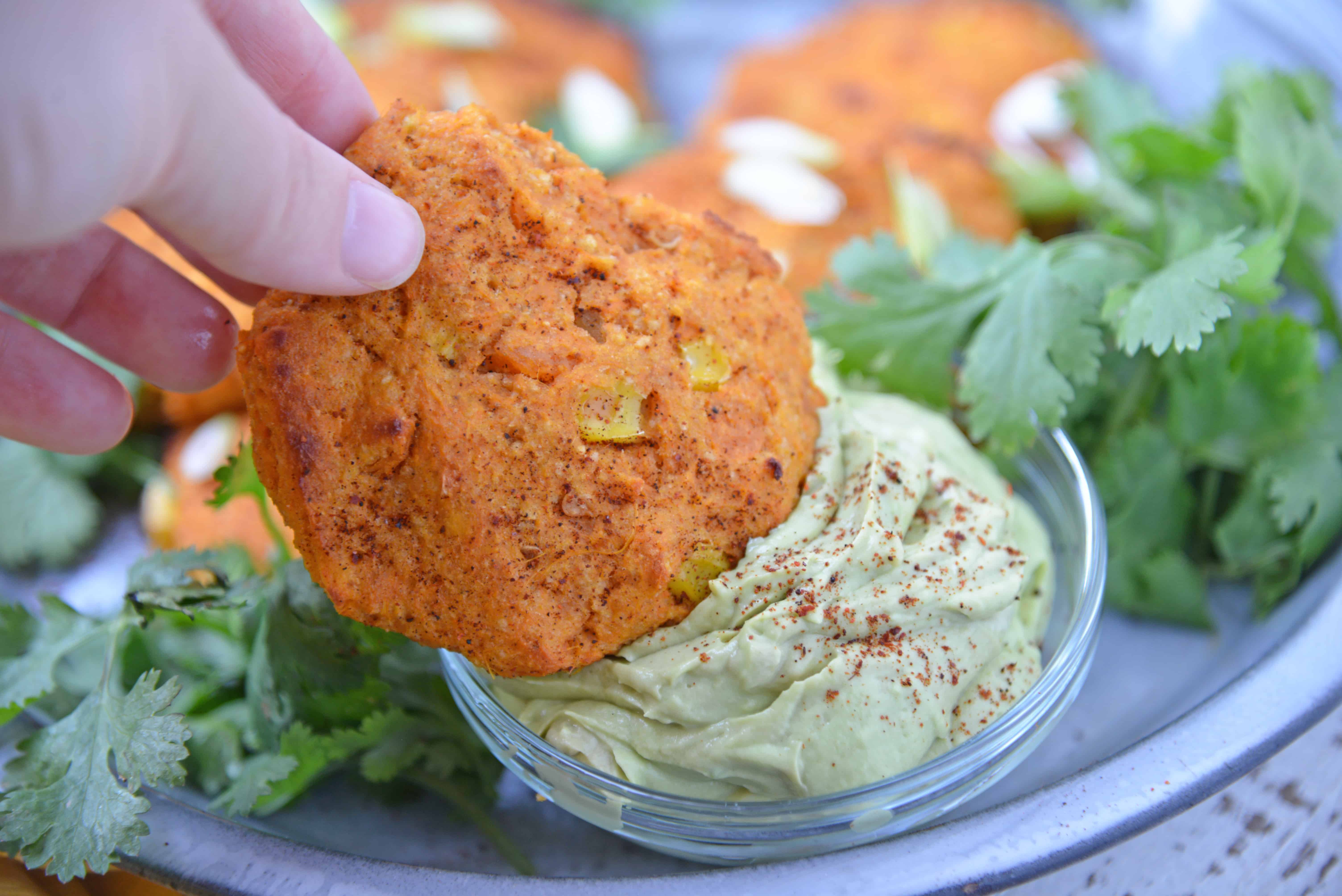 Southwestern Sweet Potato Pancakes are made with mashed sweet potatoes, green chile, corn and southwest spices making then sweet and smoky. Served with a cool, avocado dipping sauce. #potatopancakes #sweetpotatorecipe www.savoryexperiments.com