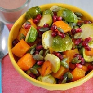 Brussels Sprout Salad Recipe is colorful and the perfect blend of sweet, salty, and savory. This dish is sure to have your guests going back for seconds. #brusselssprouts #sidedish #sweetandsavory www.savoryexperiments.com