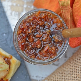 Bourbon Bacon Jam in a jar with a knife