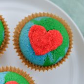 close up of an earth cupcake with a red heart