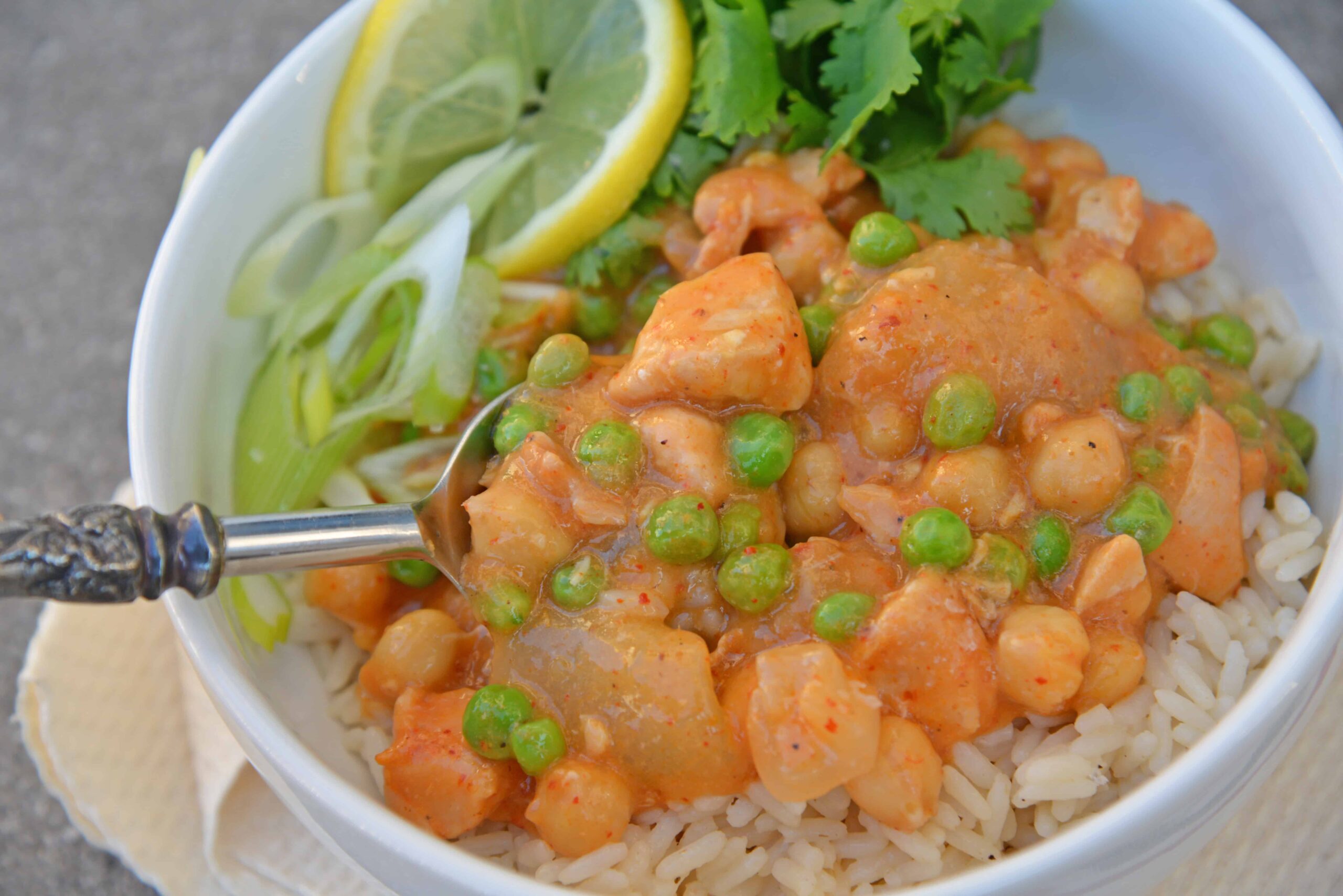 Slow Cooker Chicken Korma is a healthier way to prepare dinner! Only 10 minutes of prep time and into the pot! Loaded with dietary fiber and protein. #chickenkorma #easyindianrecipes #redcurryrecipes www.savoryexperiments.com