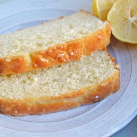 Yogurt, fresh lemon and almond give this sunny loaf cake a unique flavor and texture that everyone will love. Perfect for brunch, tea or dessert! #loafcake #lemoncake #almondcake www.savoryexperiments.com