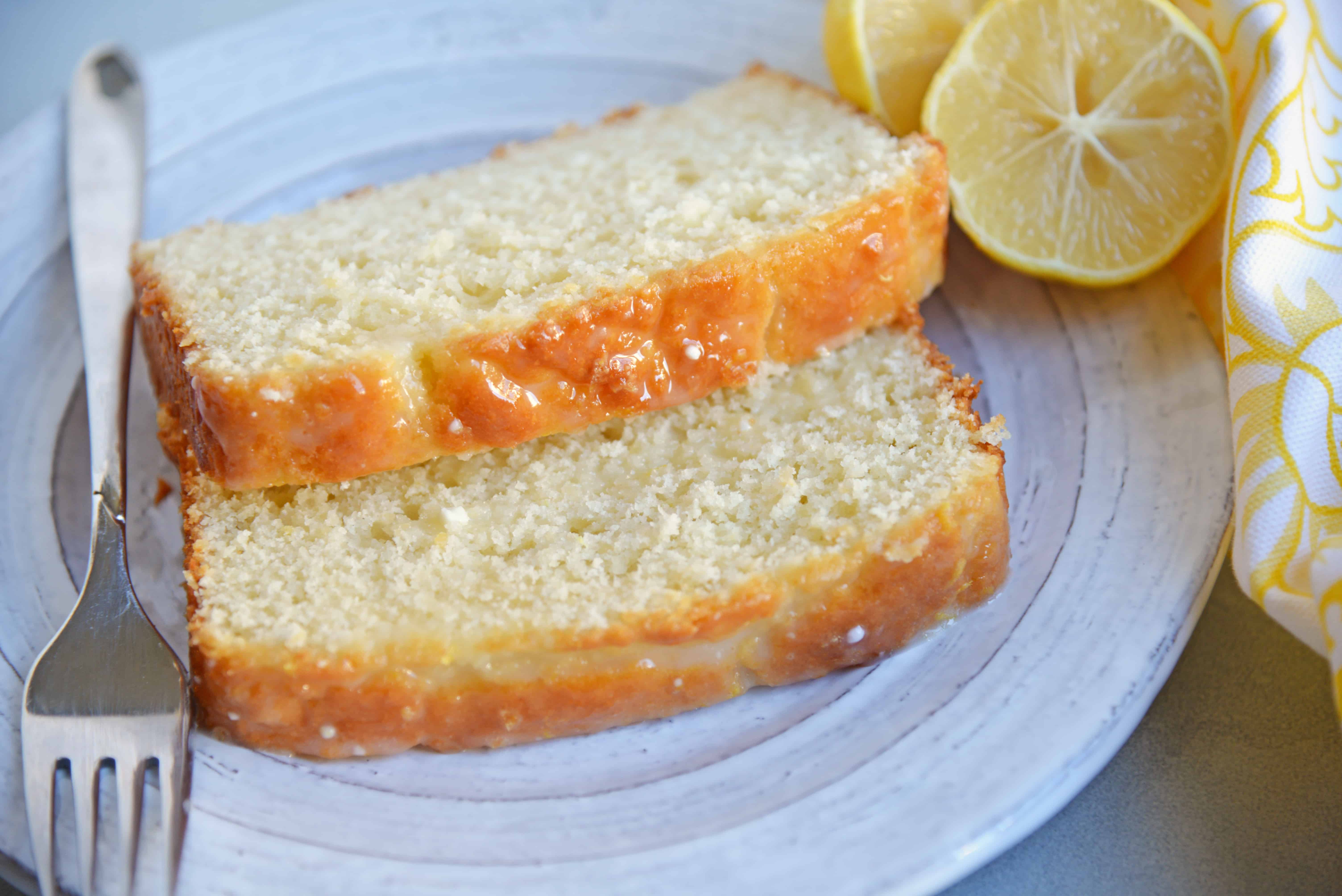 Yogurt, fresh lemon and almond give this sunny loaf cake a unique flavor and texture that everyone will love. Perfect for brunch, tea or dessert! #loafcake #lemoncake #almondcake www.savoryexperiments.com