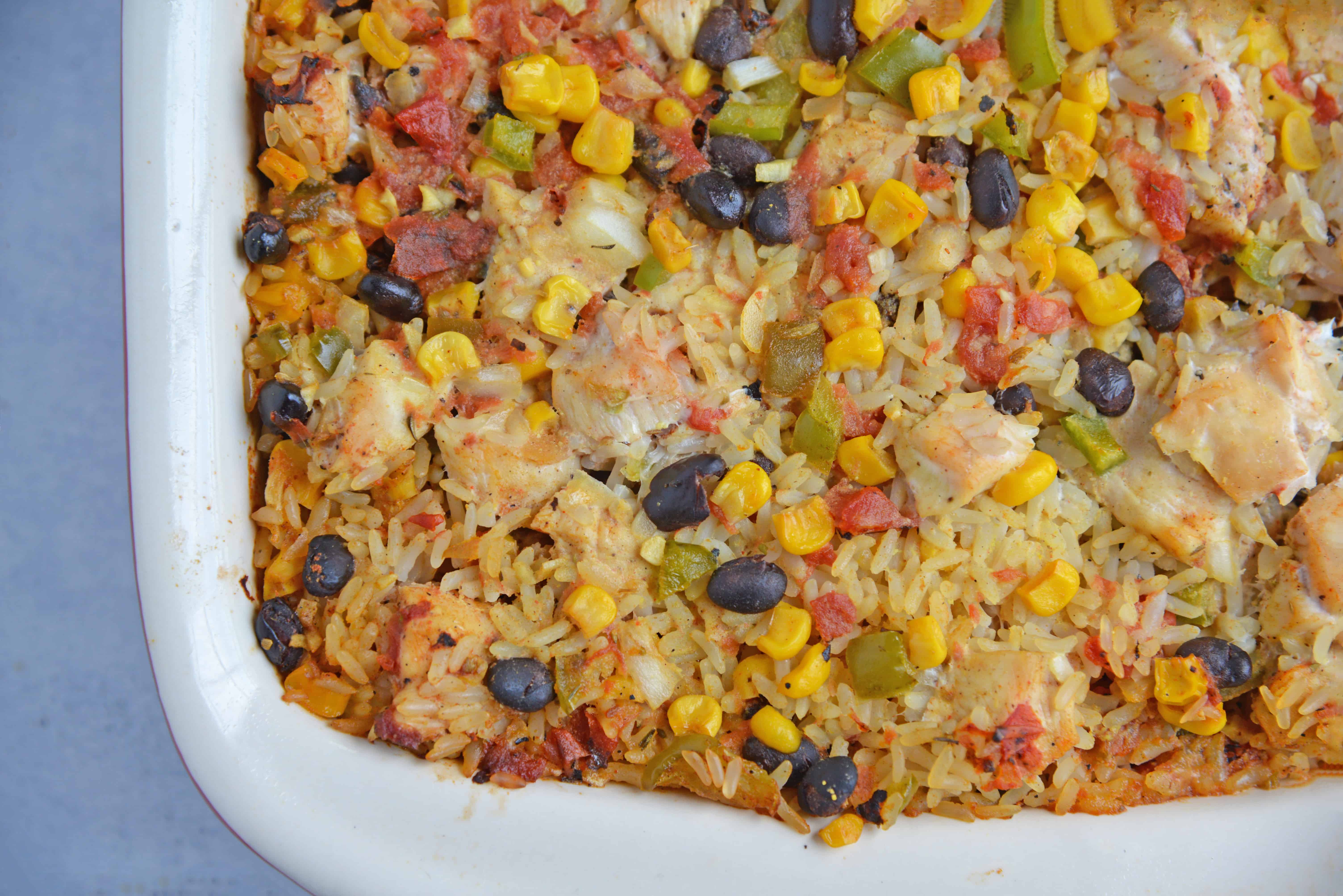 Southwest Chicken Casserole is an easy one-dish meal using chicken, rice, black beans, tomato, corn and southwest spices. #chickencasserole #onedishchickenrecipe www.savoryexperiments.com