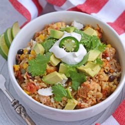Southwest Chicken Casserole is an easy one-dish meal using chicken, rice, black beans, tomato, corn and southwest spices. #chickencasserole #onedishchickenrecipe www.savoryexperiments.com