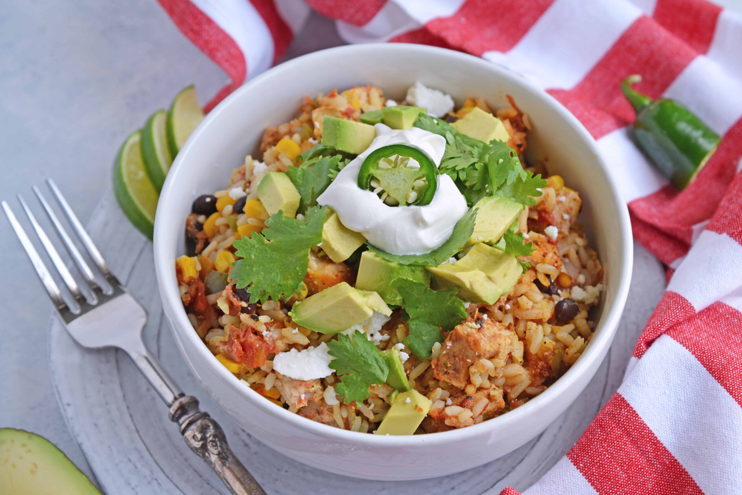 Southwest Chicken Casserole is an easy one-dish meal using chicken, rice, black beans, tomato, corn and southwest spices. #chickencasserole #onedishchickenrecipe www.savoryexperiments.com