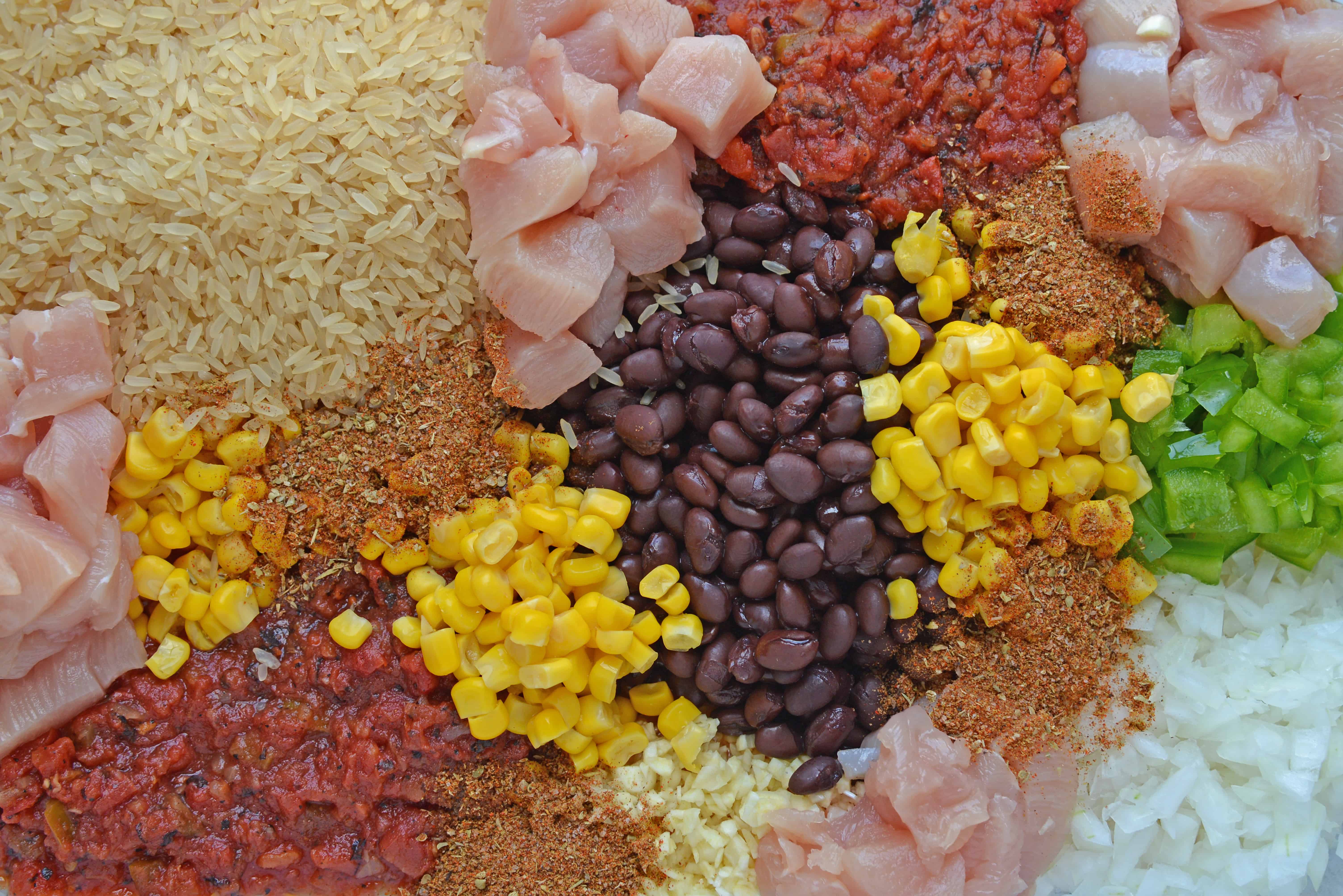 Southwest Chicken Casserole is an easy one-dish meal using chicken, rice, black beans, tomato, corn and southwest spices. #chickencasserole #onedishchickenrecipe www.savoryexperiments.com