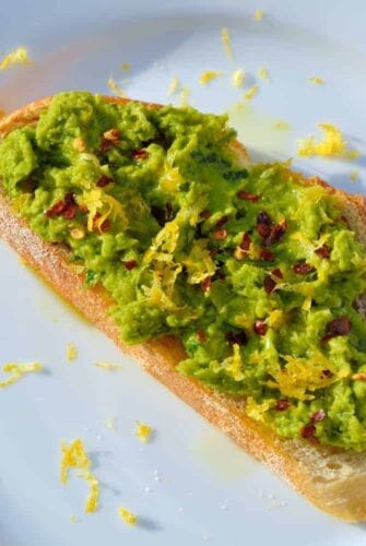 Serve Lemony Pea Mash Crostinis with at room temperature with a chilled, crisp white wine for a vibrant and colorful appetizer. | #peacrostinis | www.savoryexperiments.com