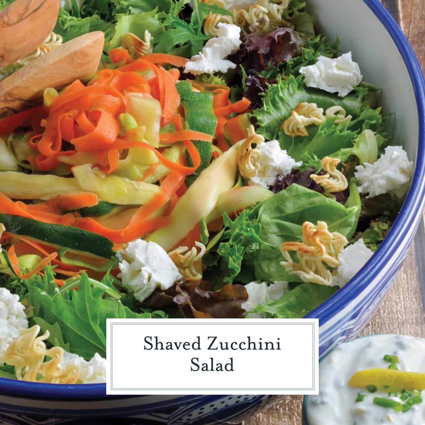 Shaved Zucchini Salad with Lemon-Chive Dressing - spring greens, soft goat cheese, toasted ramen croutons, marinated zucchini, squash and carrots with a yogurt-based lemon chive dressing. #zucchinisalad #homemadesaladdressing www.savoryexperiments.com