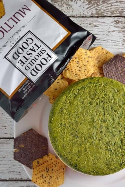 Layered Two Pesto and Ricotta Dip recipe features three distinct layers of red and green pesto with blended cheeses paired with Food Should Taste Good™ chips. | #foodshouldtastegood #sp | www.savoryexperiments.com