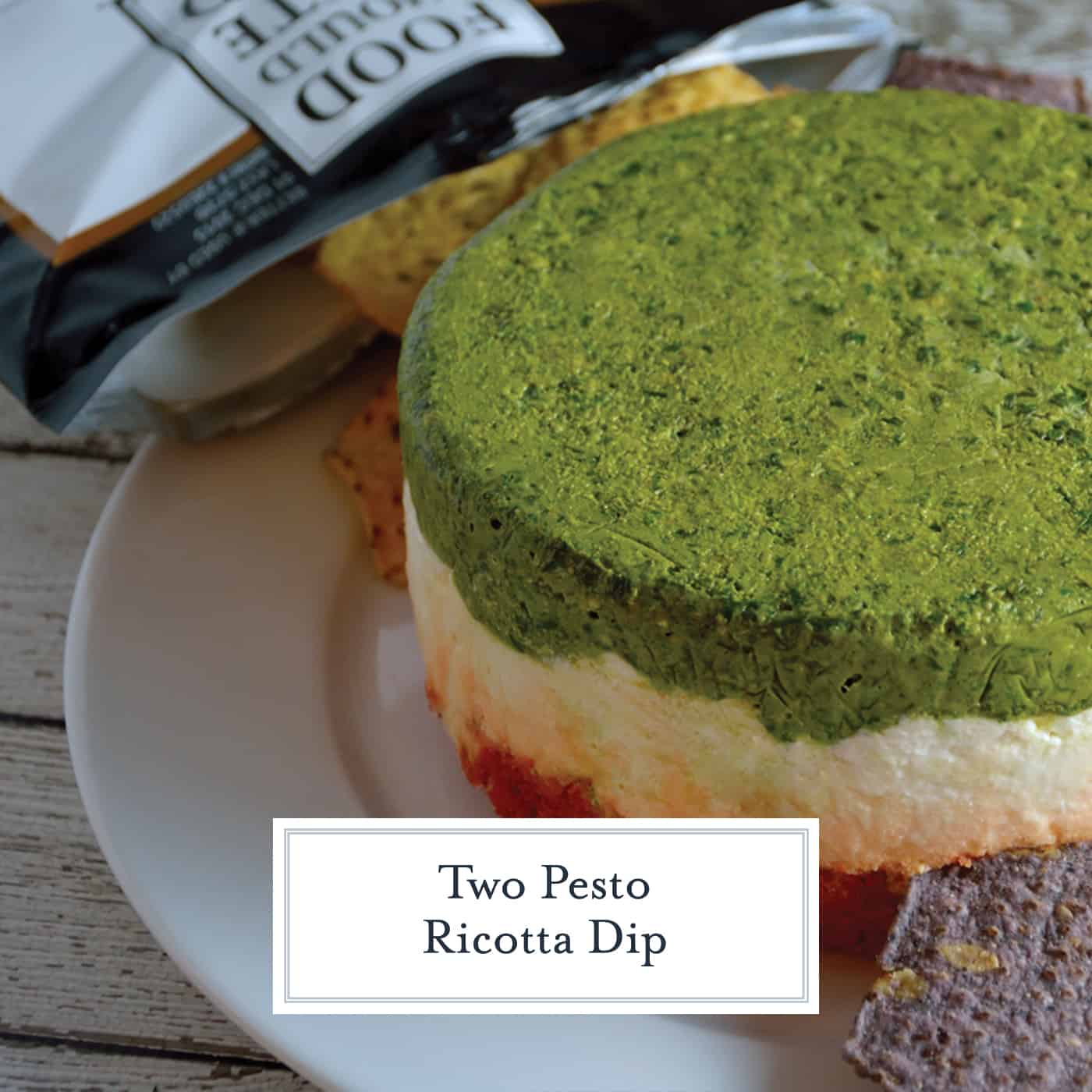 Two Pesto Ricotta Dip combines layers of traditional basil pesto, roasted red pepper and sun dried tomato pesto with ricotta, goat and Parmesan cheese. Chilled in a mold, it is a beautiful red, green and white! #pestodip #ricottadip www.savoryexperiments.com