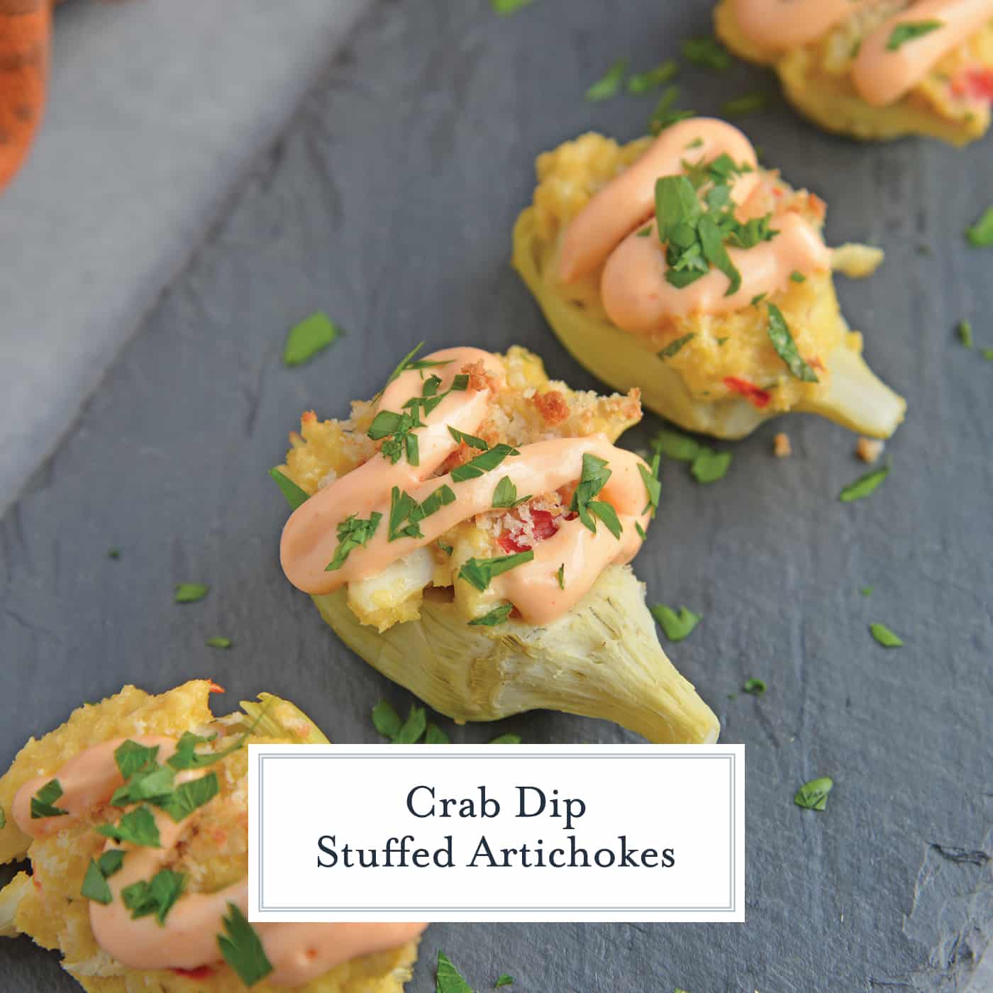 angled shot of crab dip stuffed artichoke hearts with text overlay for facebook