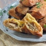 Pull Pork and Smoked Gouda Egg Rolls Recipe - Succulent, sweet and zesty pulled pork wrapped in a crispy egg roll with silky smoked gouda cheese and served alongside Avocado Green Goddess Dressing.