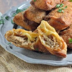 Pull Pork and Smoked Gouda Egg Rolls Recipe - Succulent, sweet and zesty pulled pork wrapped in a crispy egg roll with silky smoked gouda cheese and served alongside Avocado Green Goddess Dressing.