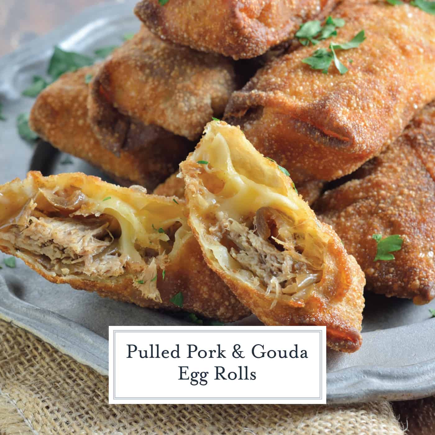 Pulled Pork and Gouda Egg Rolls are succulent, sweet and zesty pulled pork wrapped in a crispy egg roll with silky smoked gouda cheese and served alongside Avocado Green Goddess Dressing. #homemadeeggrolls www.savoryexperiments.com 